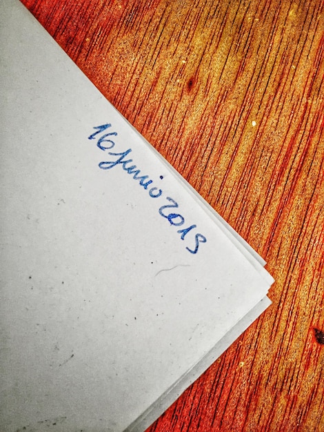A close-up shot of a script page with notes and highlights, alongside a historical novel opened to a marked page. A pair of glasses rests on the novel, symbolizing the careful study and analysis required for adaptation.