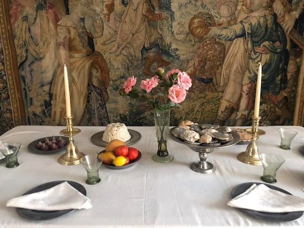 A detailed shot of a meticulously decorated dining table in a period drama, showcasing antique silverware, porcelain dishes, and crystal glassware. The table is set for a formal dinner, and the lighting is warm and inviting.