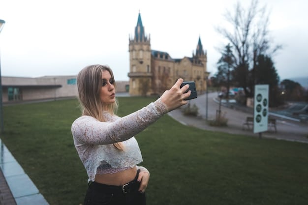 Tourists taking photos outside Alnwick Castle, known as Hogwarts in the Harry Potter films and also featured in some period dramas.