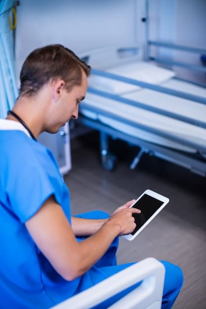 A nurse using a tablet to record patient information and vital signs, highlighting the integration of technology in modern emergency room triage processes.