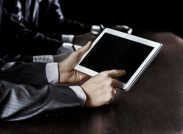 A close-up shot of a modern courtroom scene with lawyers using tablets and digital displays to present evidence to the jury.