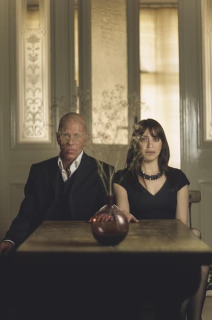 A courtroom scene from a legal drama, focused on the tense faces of the lawyers and the defendant as they await a verdict.