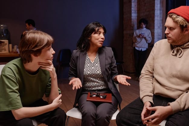 A behind-the-scenes photo of a legal drama set, showing a writer in discussion with a mental health professional, both reviewing a script together with sensitivity and seriousness.